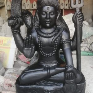 This exquisite Lord Shiva Murti is handcrafted by experienced Nepali artisans using premium-quality natural stone and traditional carving techniques. Lord Shiva, one of the principal deities of Hinduism and a member of the Holy Trinity (Trimurti), is revered as the destroyer of evil, the transformer, and the embodiment of meditation, compassion, and inner peace. The statue showcases intricate detailing and exceptional craftsmanship, reflecting Nepal's rich artistic and spiritual heritage. Whether placed in a temple, home altar, meditation room, or garden, this murti creates a serene and sacred atmosphere while symbolizing strength, wisdom, protection, and spiritual awakening. Features Handmade by skilled Nepali artisans Crafted from premium-quality natural stone Traditional Nepali stone carving with intricate detailing Symbolizes peace, strength, protection, and spiritual transformation Ideal for temples, home shrines, meditation rooms, gardens, and spiritual centers Suitable for both indoor and outdoor display Durable, weather-resistant, and easy to maintain Specifications Material: Natural Stone Origin: Nepal Finish: Hand-Carved Natural Stone Finish Style: Traditional Nepali Religious Sculpture Usage: Worship, Temple Decoration, Home Décor, Garden Decoration, Meditation Space, Gift Item Bring the divine presence of Lord Shiva into your home or temple with this beautifully handcrafted stone murti. A timeless symbol of peace, power, and spiritual enlightenment, it reflects the exceptional craftsmanship of Nepalese artisans and serves as a meaningful addition to any sacred or decorative space.