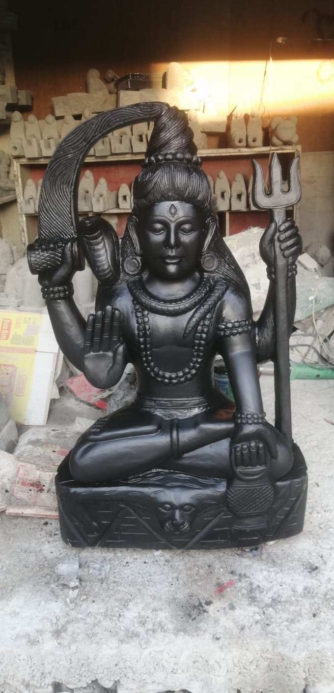 This exquisite Lord Shiva Murti is handcrafted by experienced Nepali artisans using premium-quality natural stone and traditional carving techniques. Lord Shiva, one of the principal deities of Hinduism and a member of the Holy Trinity (Trimurti), is revered as the destroyer of evil, the transformer, and the embodiment of meditation, compassion, and inner peace. The statue showcases intricate detailing and exceptional craftsmanship, reflecting Nepal's rich artistic and spiritual heritage. Whether placed in a temple, home altar, meditation room, or garden, this murti creates a serene and sacred atmosphere while symbolizing strength, wisdom, protection, and spiritual awakening. Features Handmade by skilled Nepali artisans Crafted from premium-quality natural stone Traditional Nepali stone carving with intricate detailing Symbolizes peace, strength, protection, and spiritual transformation Ideal for temples, home shrines, meditation rooms, gardens, and spiritual centers Suitable for both indoor and outdoor display Durable, weather-resistant, and easy to maintain Specifications Material: Natural Stone Origin: Nepal Finish: Hand-Carved Natural Stone Finish Style: Traditional Nepali Religious Sculpture Usage: Worship, Temple Decoration, Home Décor, Garden Decoration, Meditation Space, Gift Item Bring the divine presence of Lord Shiva into your home or temple with this beautifully handcrafted stone murti. A timeless symbol of peace, power, and spiritual enlightenment, it reflects the exceptional craftsmanship of Nepalese artisans and serves as a meaningful addition to any sacred or decorative space.